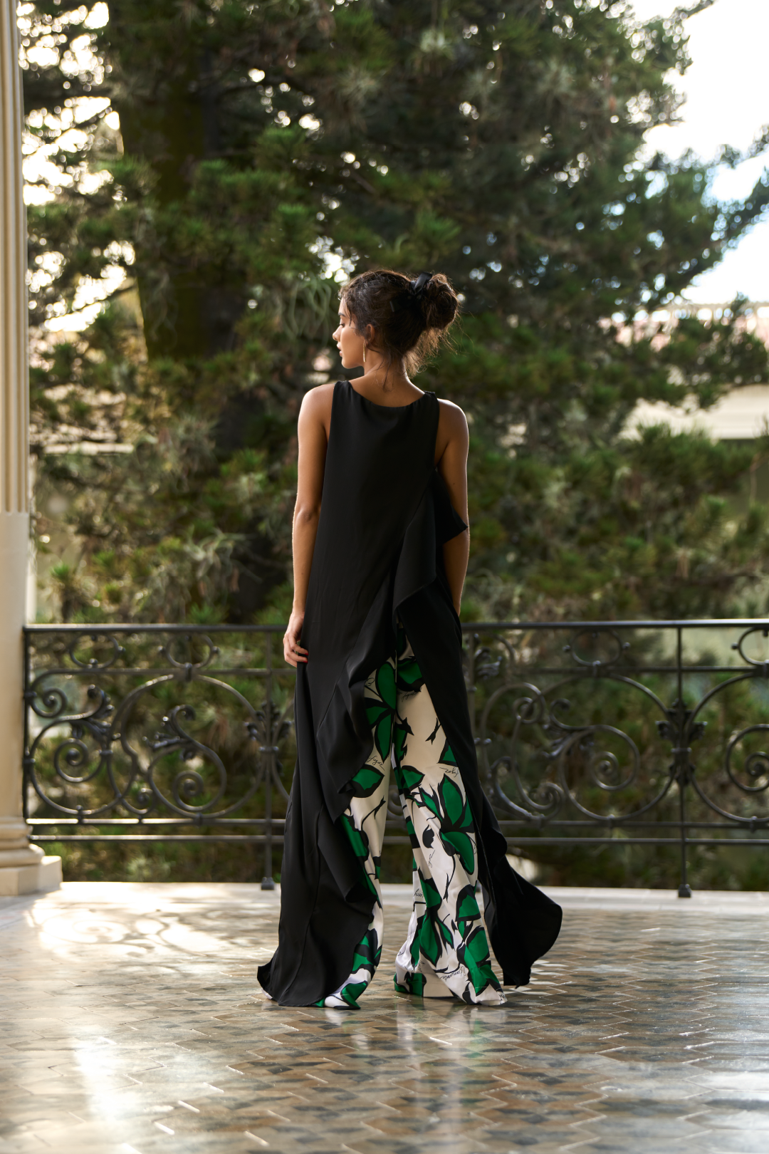 A model wearing an overlaped black top by Monica Arguedas.