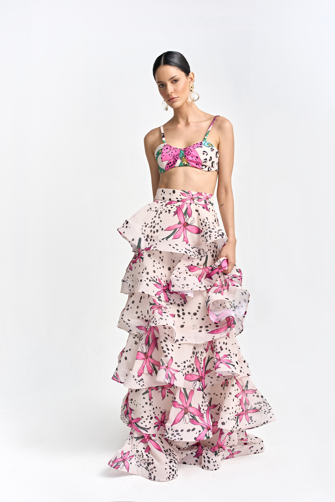 A model wearing a cream floral print bralette by Monica Arguedas.