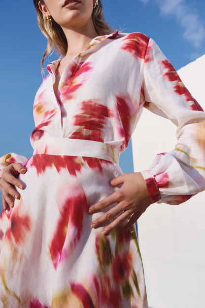 A model wearing a long sleeve top with pink floral print by Monica Arguedas.