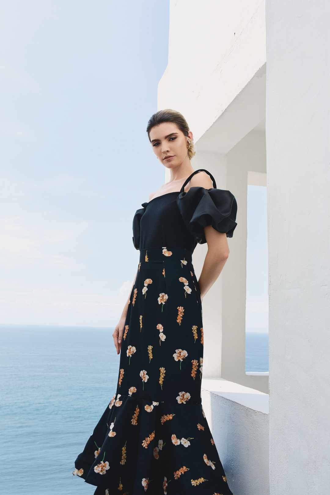 A model wearing black top with puffy sleeves by Monica Arguedas