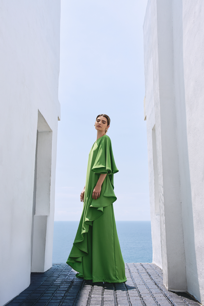 A model wearing solid green flowy pants by Monica Arguedas.
